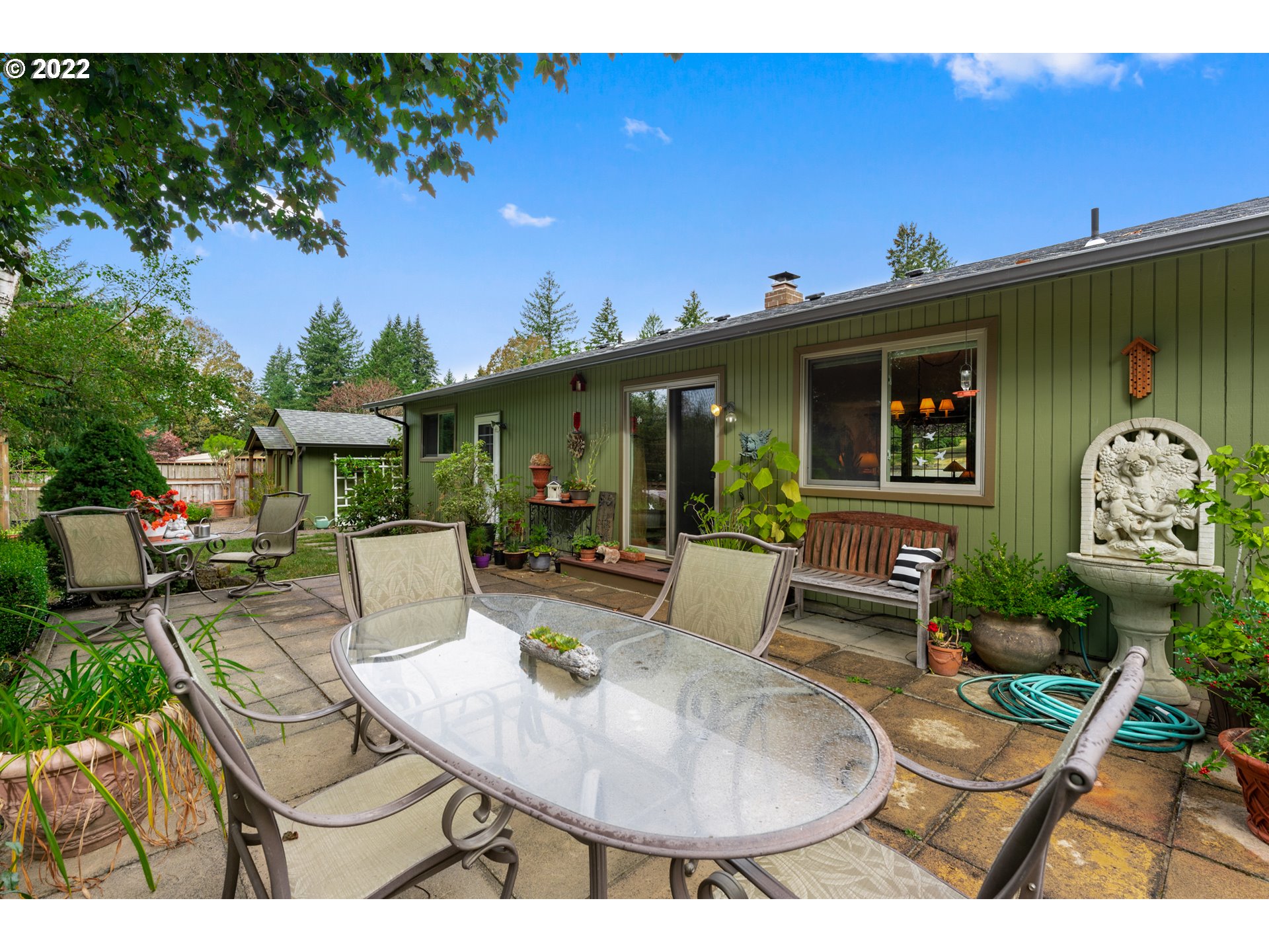 22913 Northeast 16th Street Camas, WA 98607 - Photo 21 of 32 a view of house with backyard outdoor seating and green space