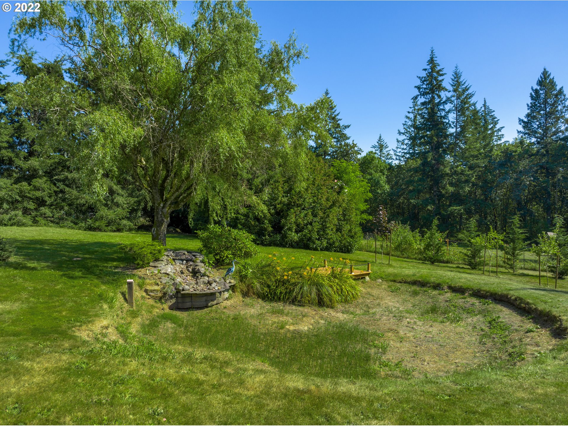 22913 Northeast 16th Street Camas, WA 98607 - Photo 23 of 32 a backyard of a house with a yard and trampoline