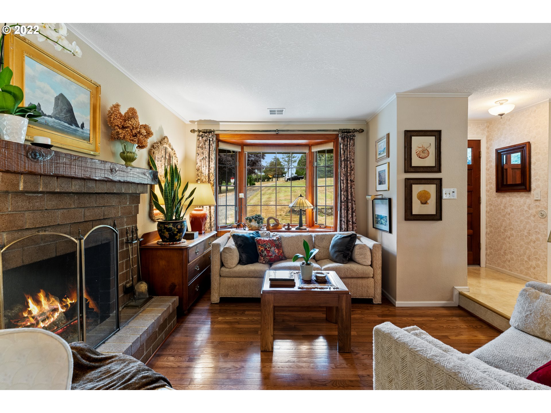 22913 Northeast 16th Street Camas, WA 98607 - Photo 4 of 32 a living room with furniture and a fireplace
