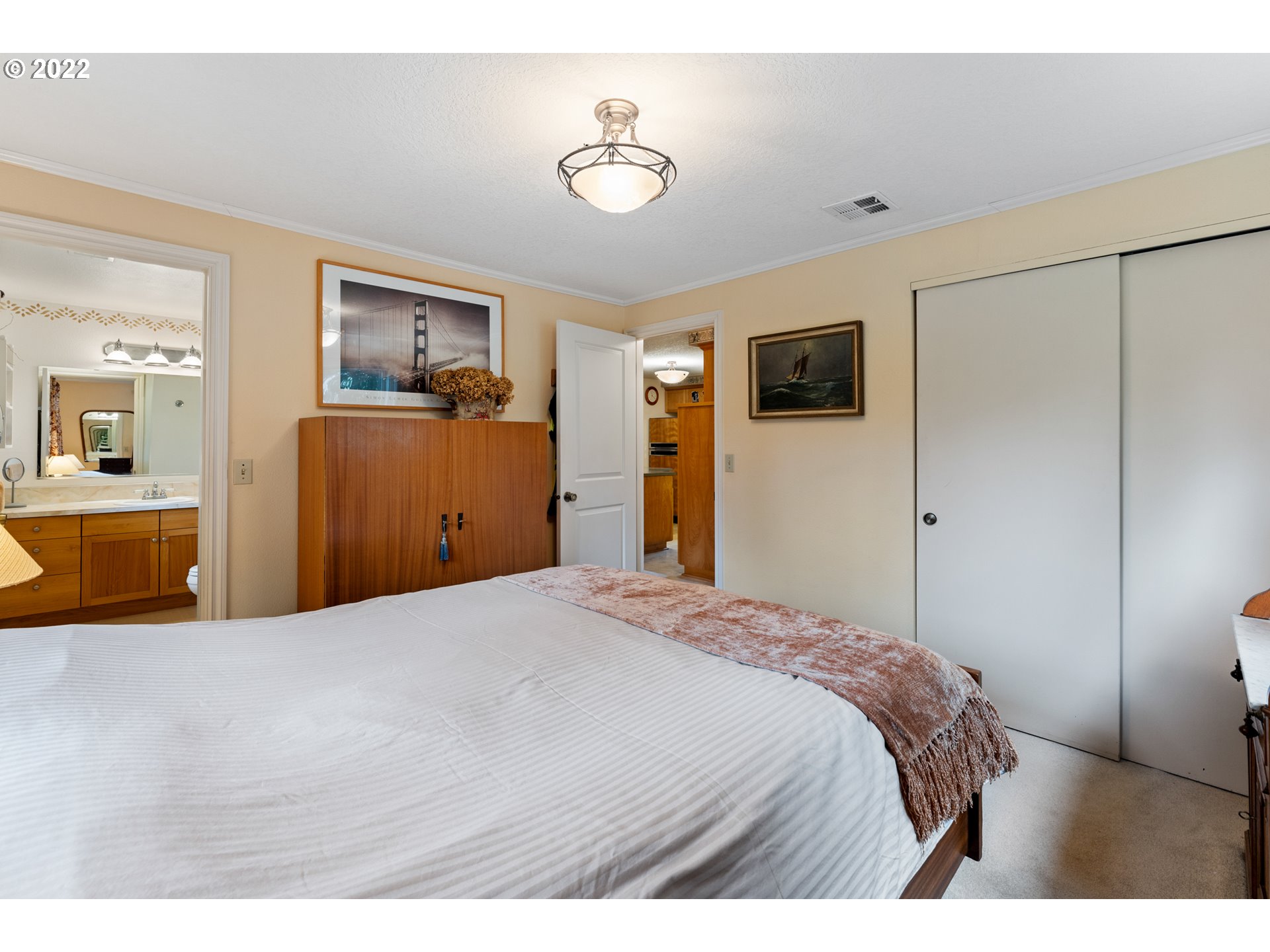 22913 Northeast 16th Street Camas, WA 98607 - Photo 10 of 32 a bedroom with a bed and a flat screen tv