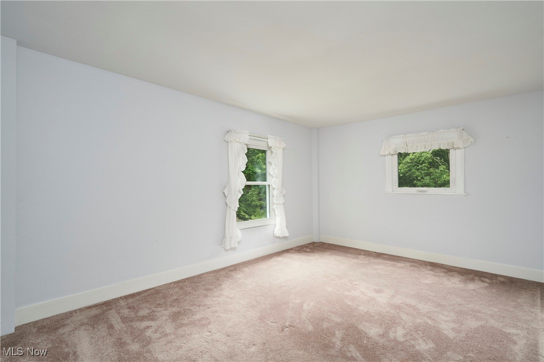 650 Rothrock Circle Akron, OH 44321 - Photo 27 of 31 Carpeted spare room featuring baseboards