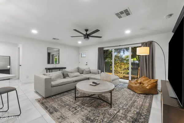 a living room with furniture and a large window