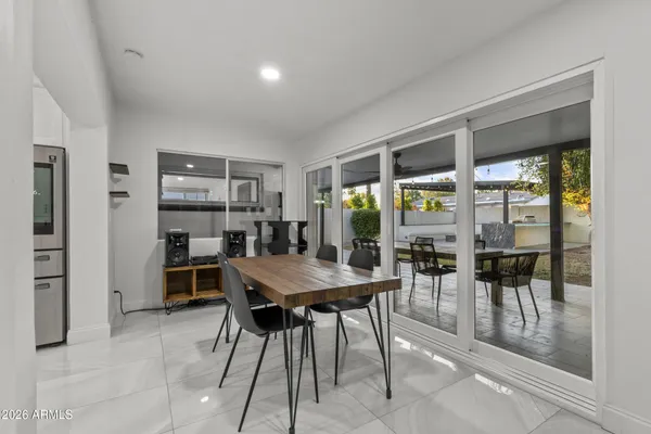 a dining room with furniture and window