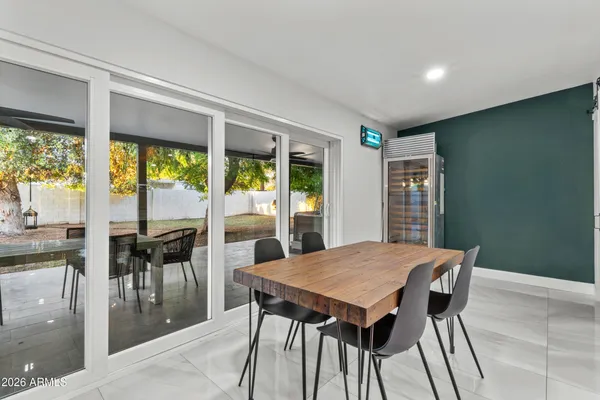a view of a dining room with furniture window and outside view