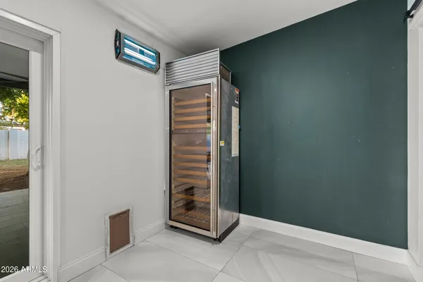 a spacious bedroom with a bed and a walk in closet