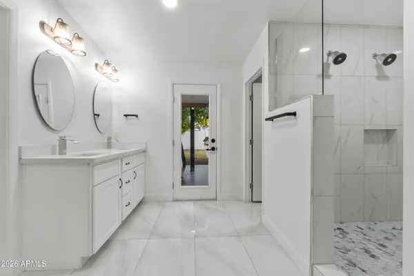 a bathroom with a shower and a sink