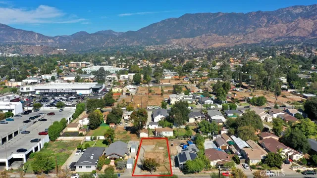 an aerial view of residential houses and outdoor space