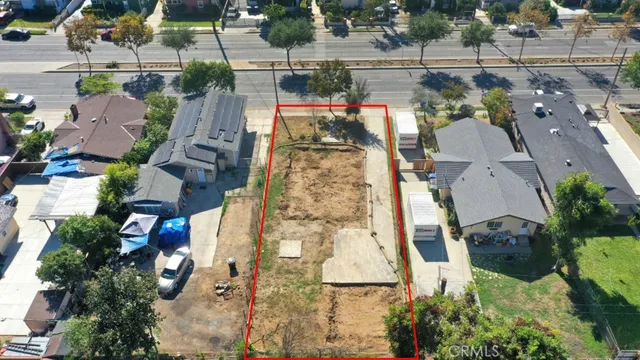 an aerial view of a houses with yard