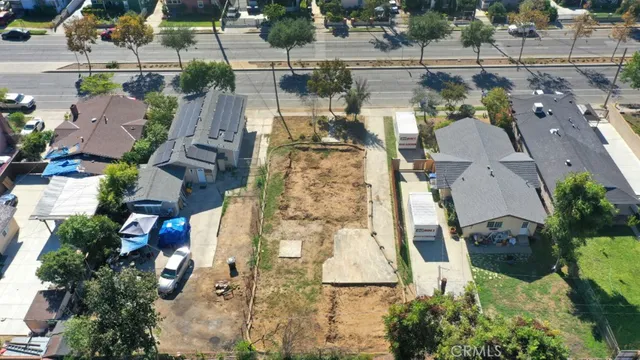 an aerial view of a house with a lake view