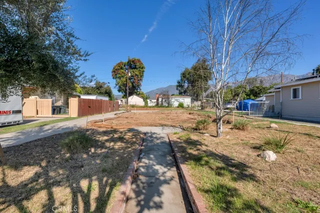 a backyard of a house with lots of green space
