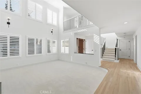 a view of an empty room with a fireplace