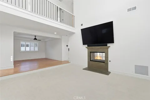 a living room with a flat screen tv and a fireplace