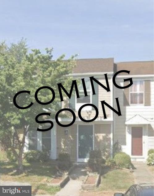 a view of a door and chair in the back yard