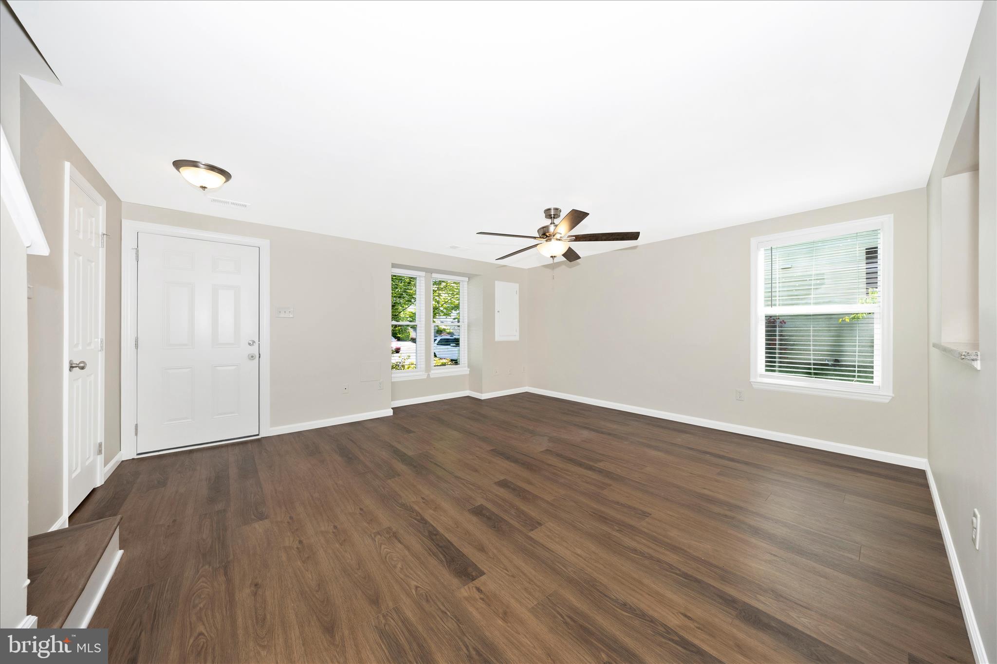 1369 David Lane Frederick, MD 21703 - Photo 11 of 53 a view of empty room with wooden floor and fan