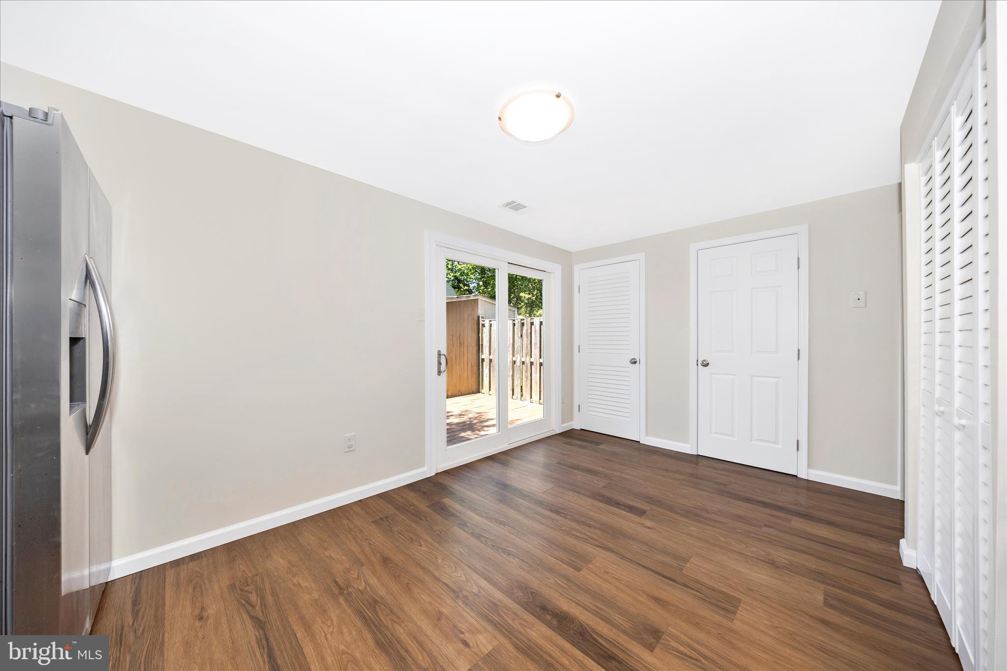 1369 David Lane Frederick, MD 21703 - Photo 16 of 53 a view of an empty room with wooden floor and a window