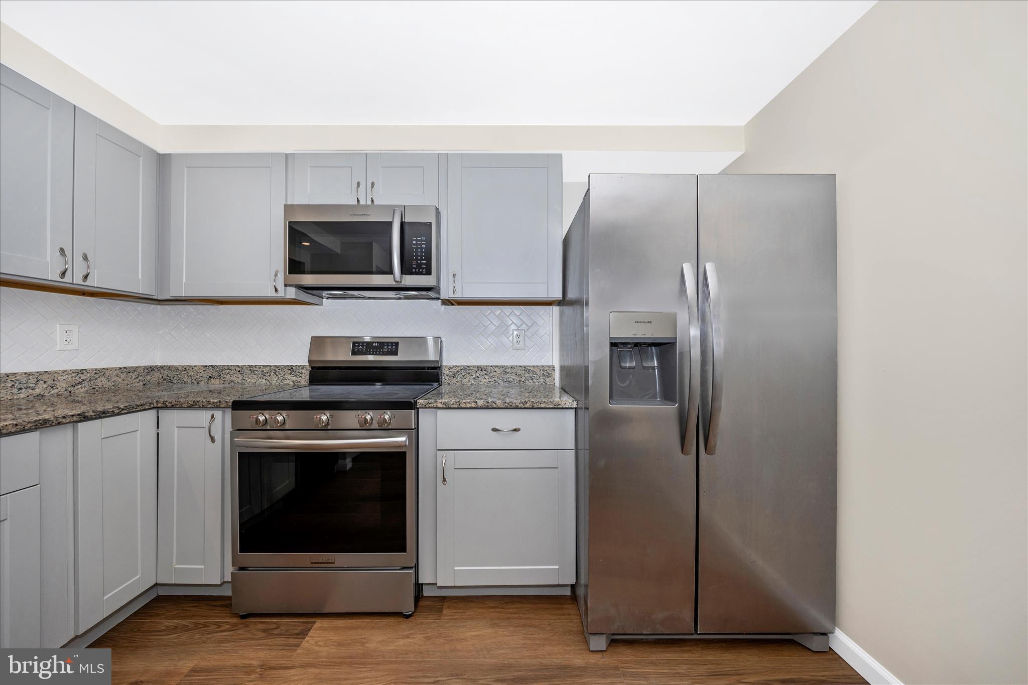 1369 David Lane Frederick, MD 21703 - Photo 21 of 53 a kitchen with cabinets stainless steel appliances and a counter space