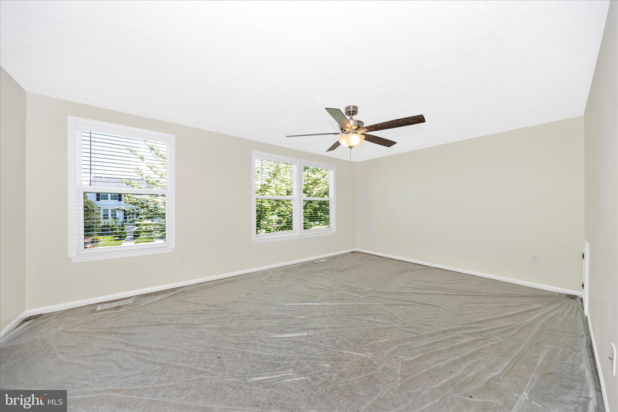1369 David Lane Frederick, MD 21703 - Photo 25 of 53 an empty room with wooden floor fan and windows