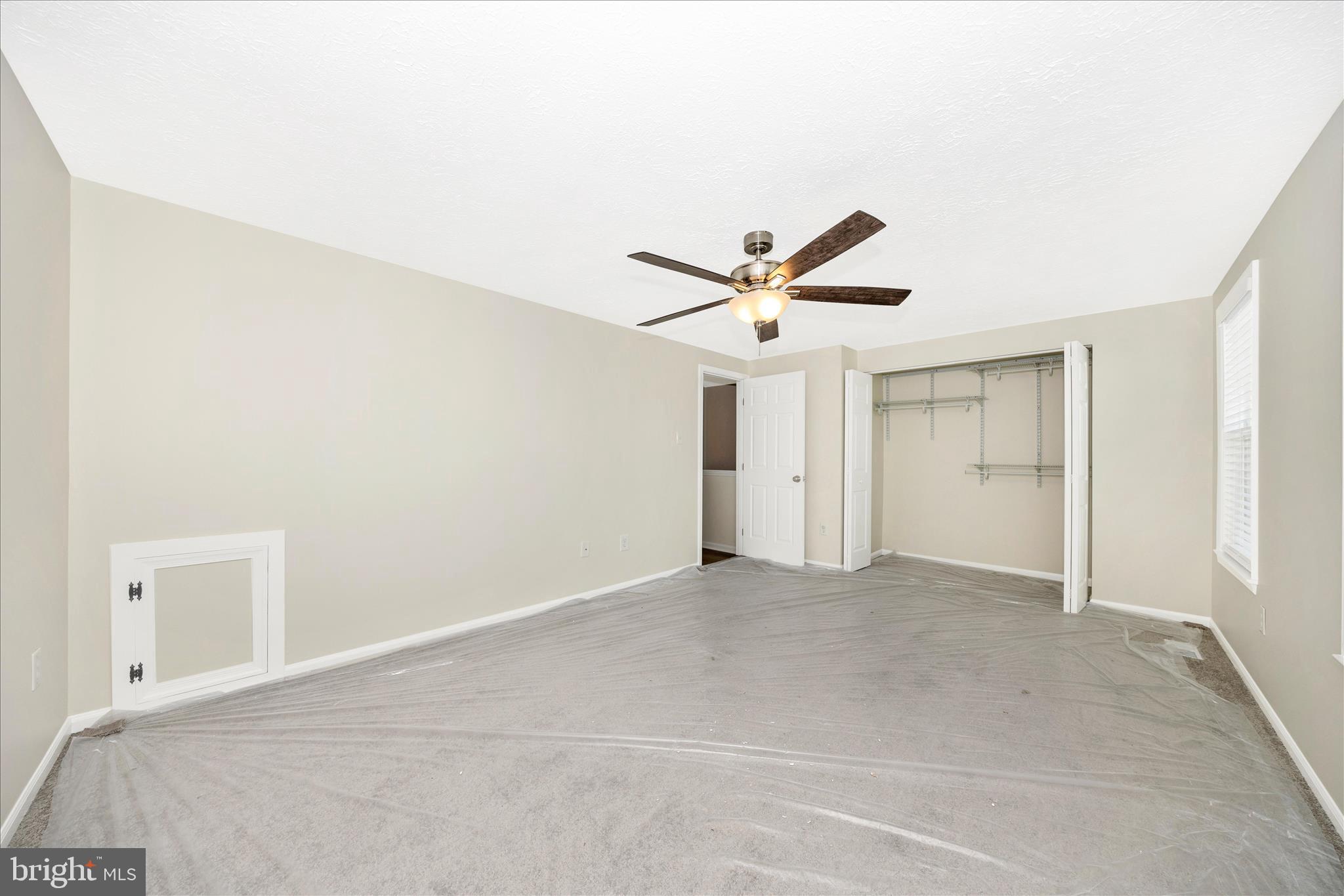 1369 David Lane Frederick, MD 21703 - Photo 27 of 53 an empty room with closet and a ceiling fan