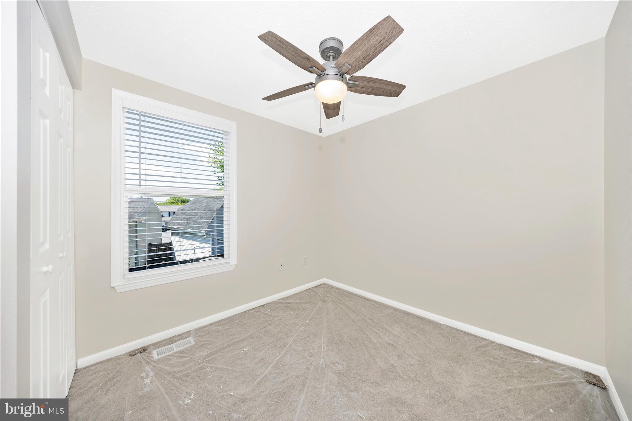 1369 David Lane Frederick, MD 21703 - Photo 30 of 53 an empty room with a window and a ceiling fan