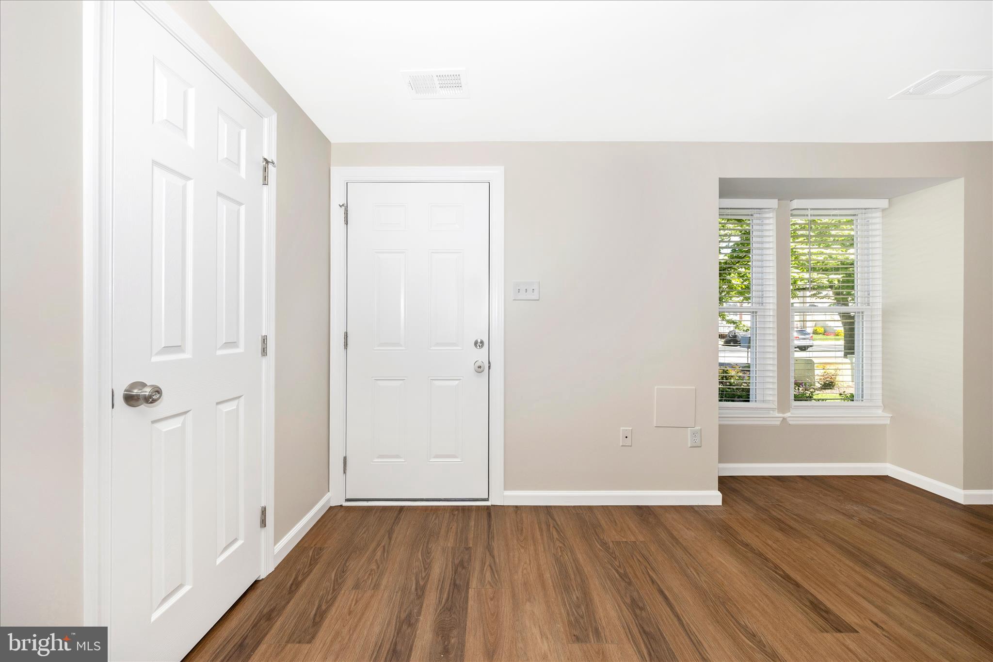 1369 David Lane Frederick, MD 21703 - Photo 3 of 53 an empty room with wooden floor and windows
