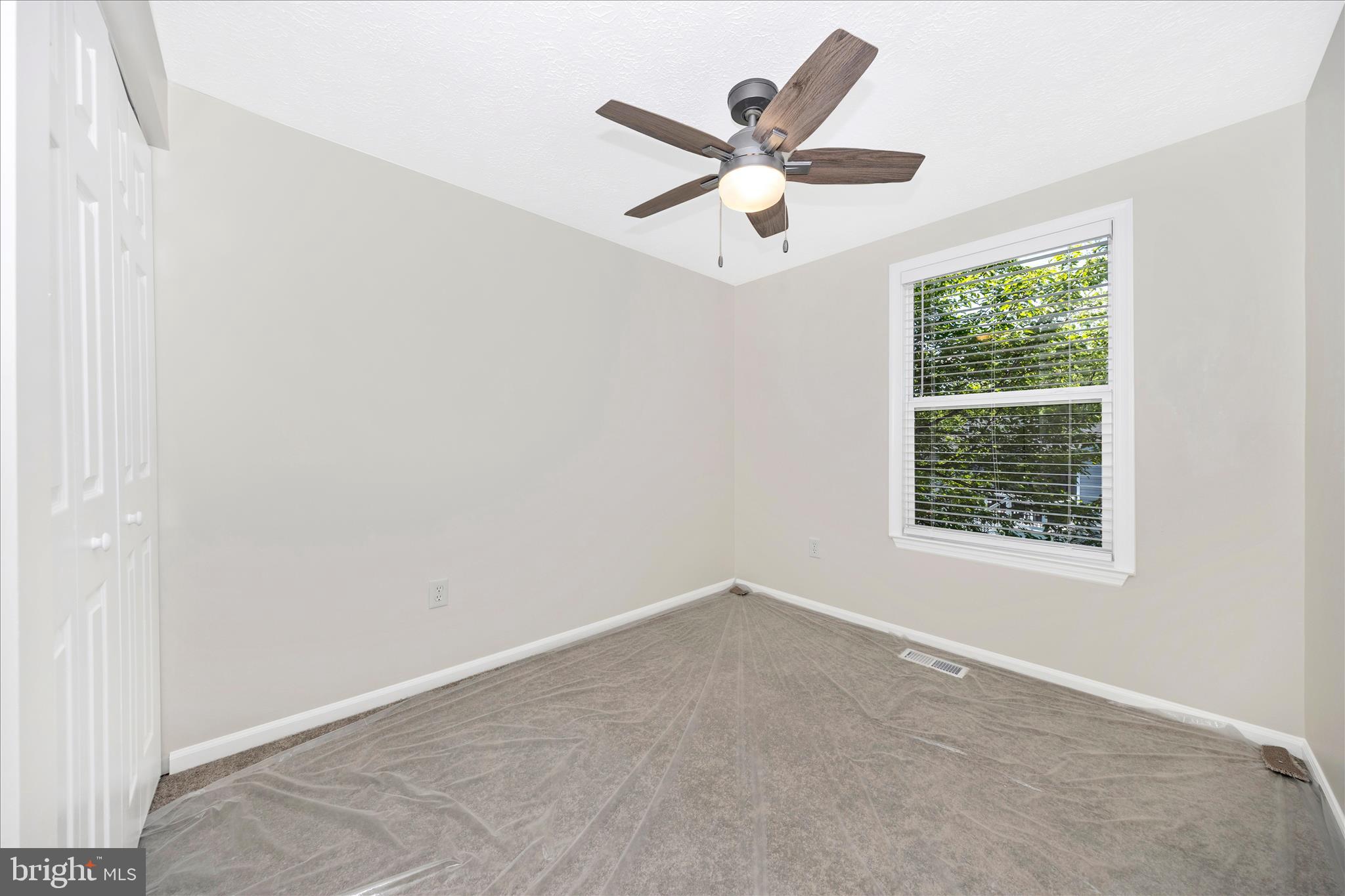 1369 David Lane Frederick, MD 21703 - Photo 34 of 53 an empty room with a window and a fan