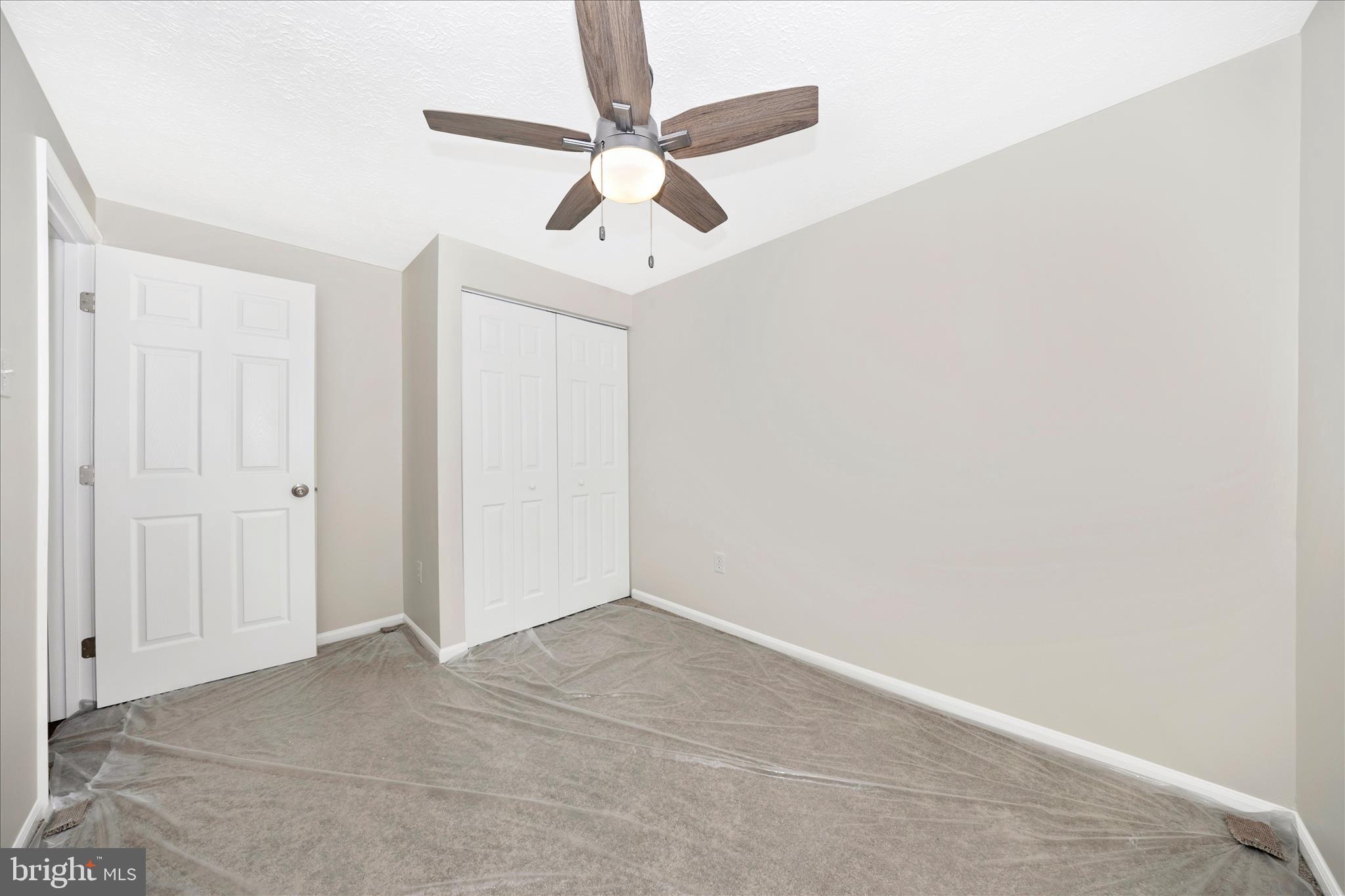 1369 David Lane Frederick, MD 21703 - Photo 36 of 53 an empty room with a ceiling fan and a window