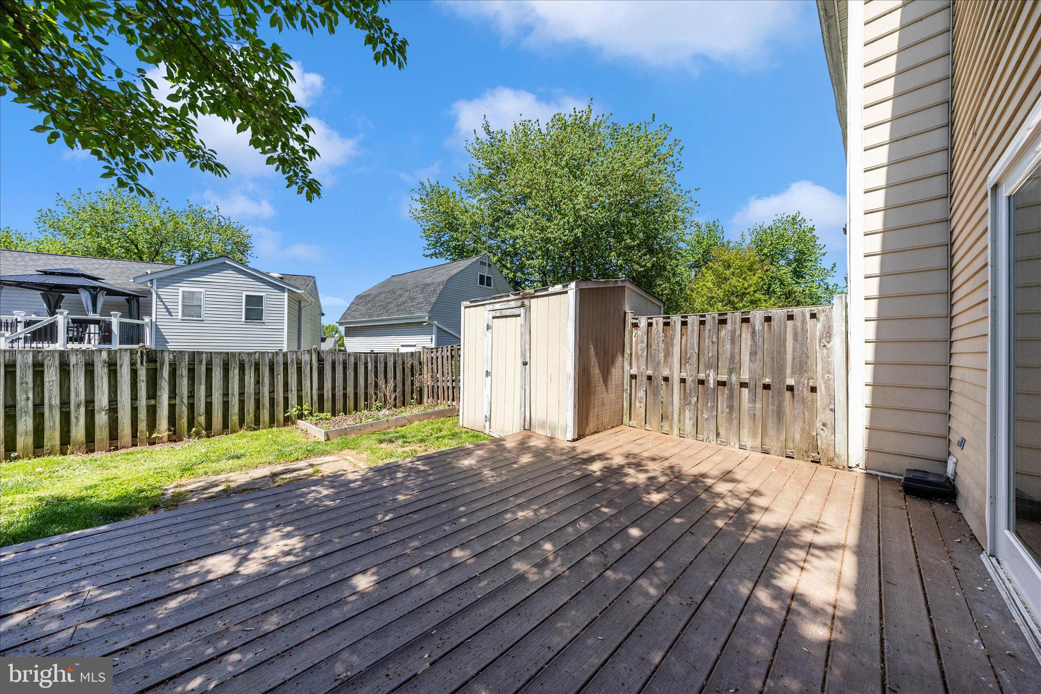 1369 David Lane Frederick, MD 21703 - Photo 50 of 53 a view of a wooden deck with a house