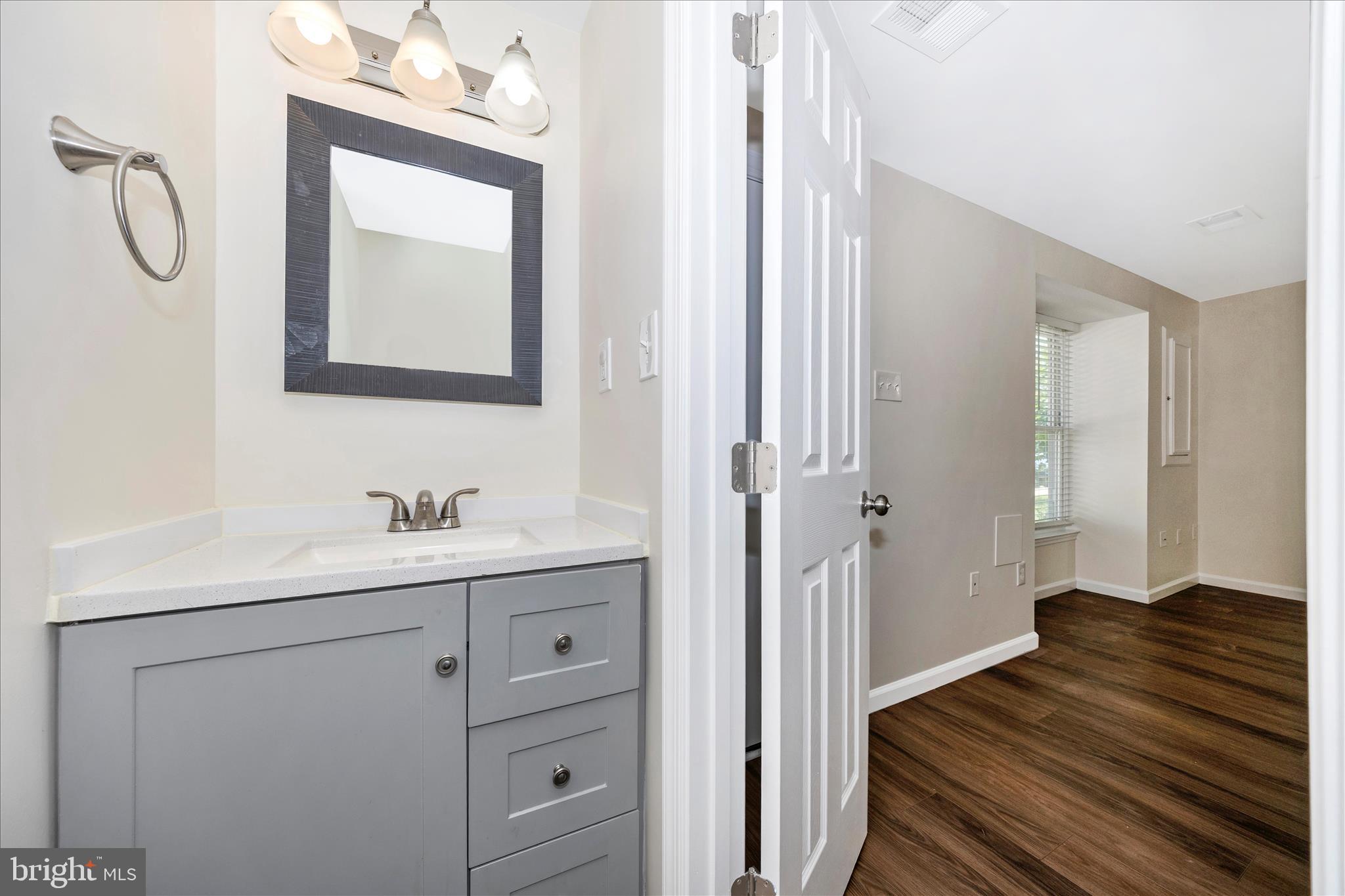 1369 David Lane Frederick, MD 21703 - Photo 5 of 53 a en suite bathroom with a toilet sink and mirror