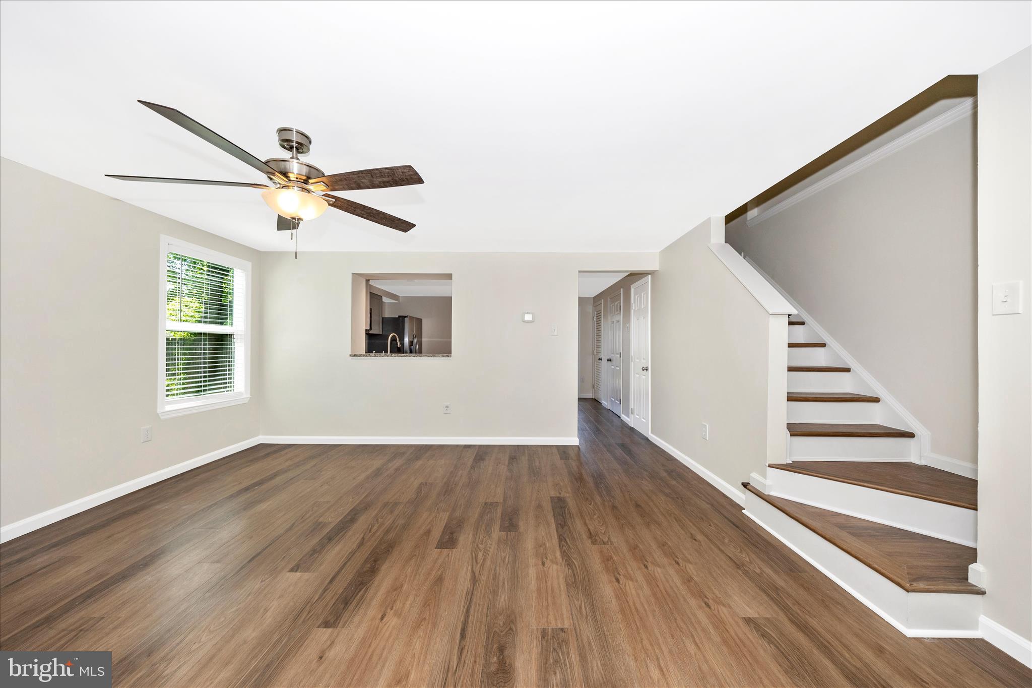 1369 David Lane Frederick, MD 21703 - Photo 6 of 53 a view of an empty room with wooden floor and a window