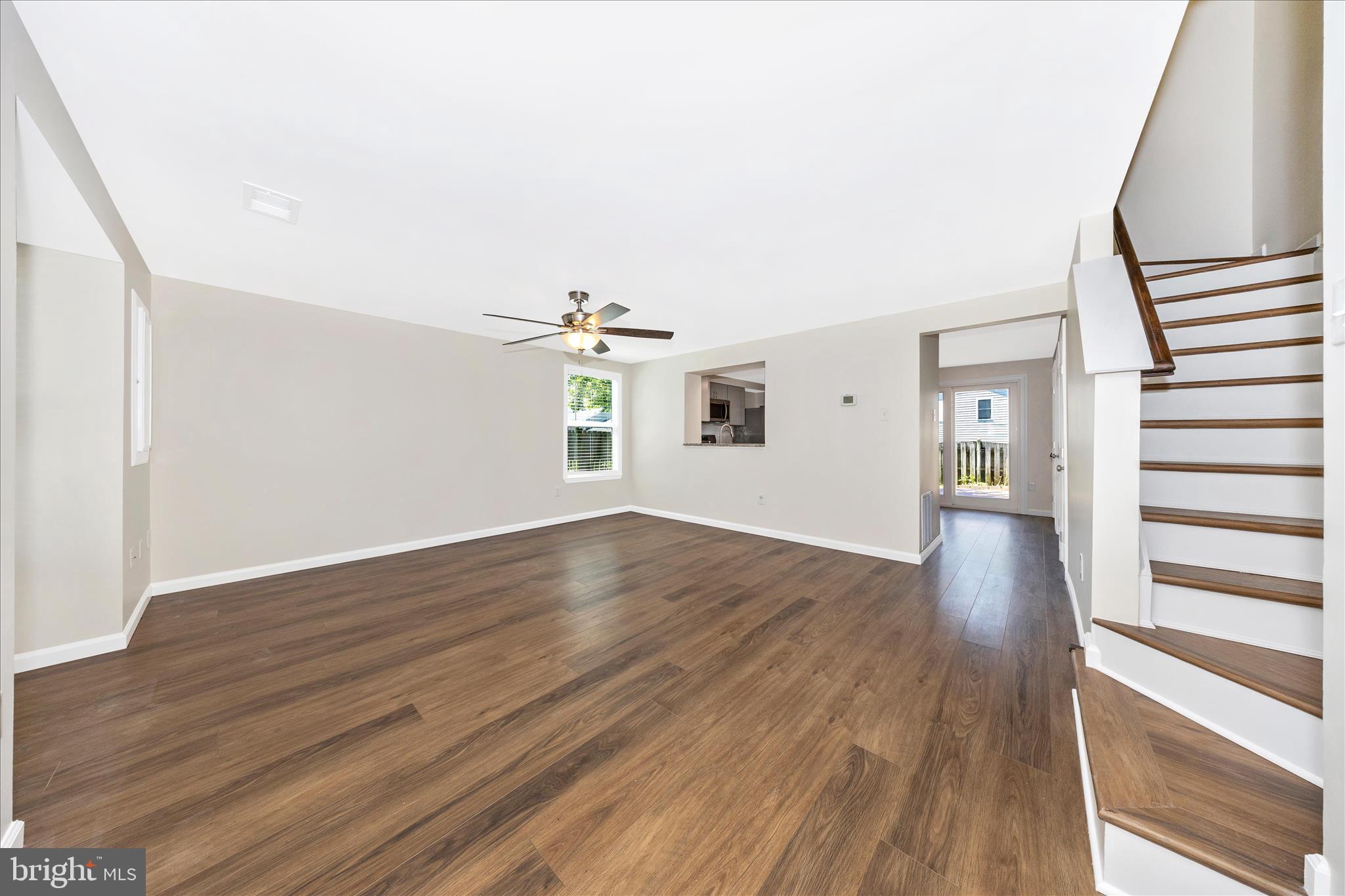 1369 David Lane Frederick, MD 21703 - Photo 7 of 53 a view of empty room with wooden floor and fan