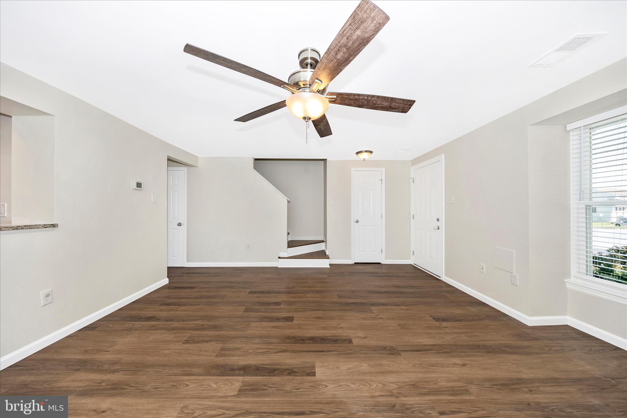 1369 David Lane Frederick, MD 21703 - Photo 8 of 53 a view of an empty room with window and wooden floor