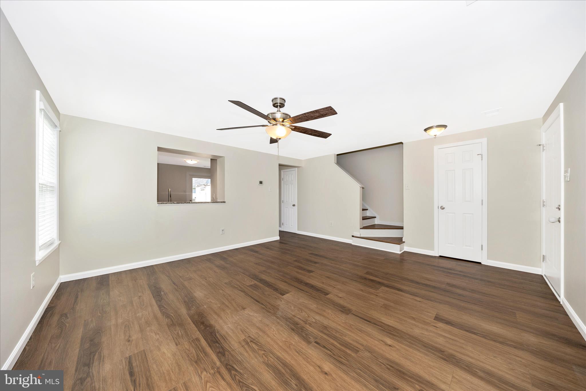 1369 David Lane Frederick, MD 21703 - Photo 9 of 53 a view of an empty room with wooden floor and a ceiling fan