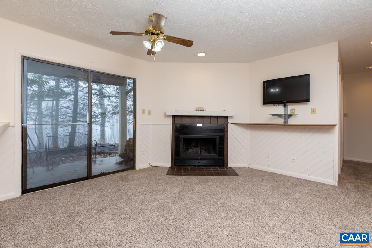 2219 Tanners Ridge Roseland, VA 22967 - Photo 2 of 10 a living room with furniture and a flat screen tv