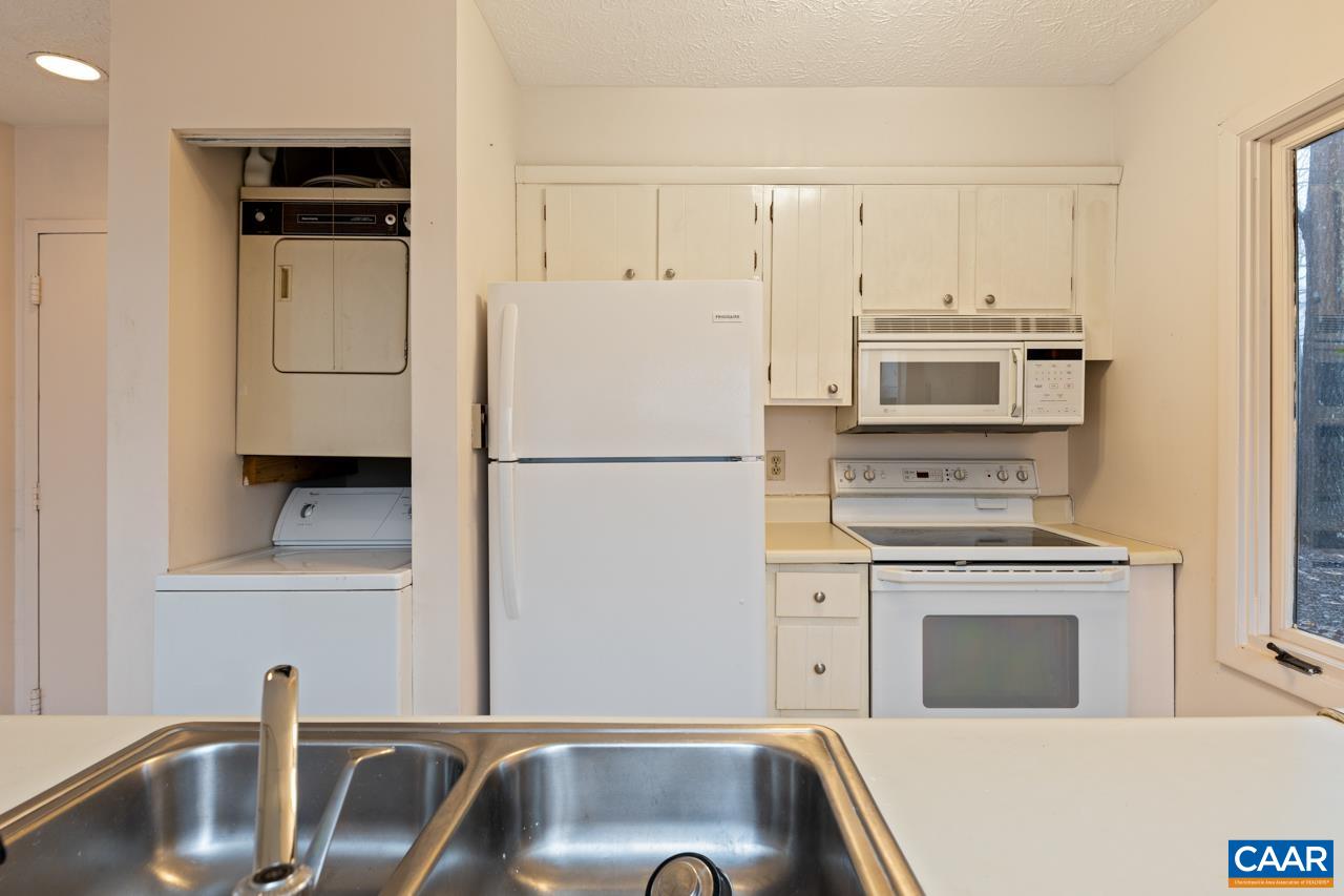 2219 Tanners Ridge Roseland, VA 22967 - Photo 5 of 10 a kitchen with white cabinets and stainless steel appliances