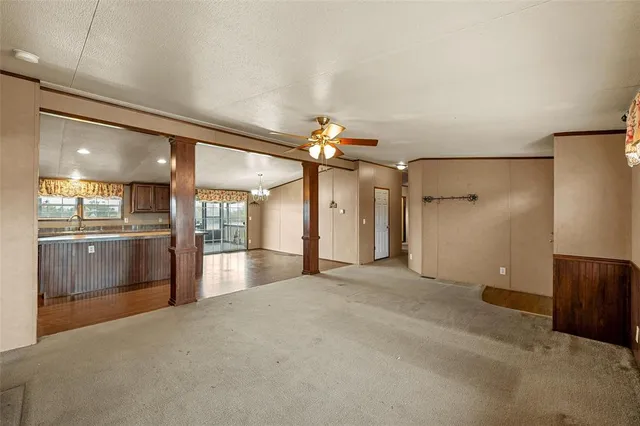 a view of an empty room with a stove