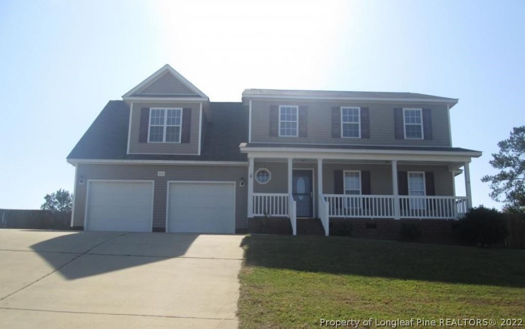 44 Scotland Drive Spring Lake, NC 28390 - Photo 1 of 2 a front view of a house with garden