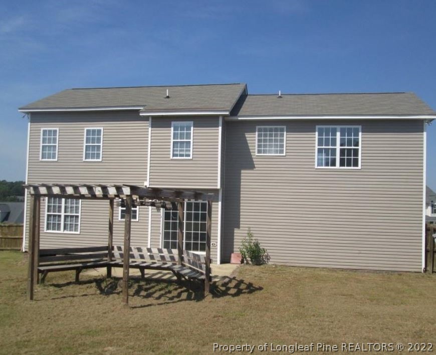 44 Scotland Drive Spring Lake, NC 28390 - Photo 2 of 2 a front view of a house with a garden