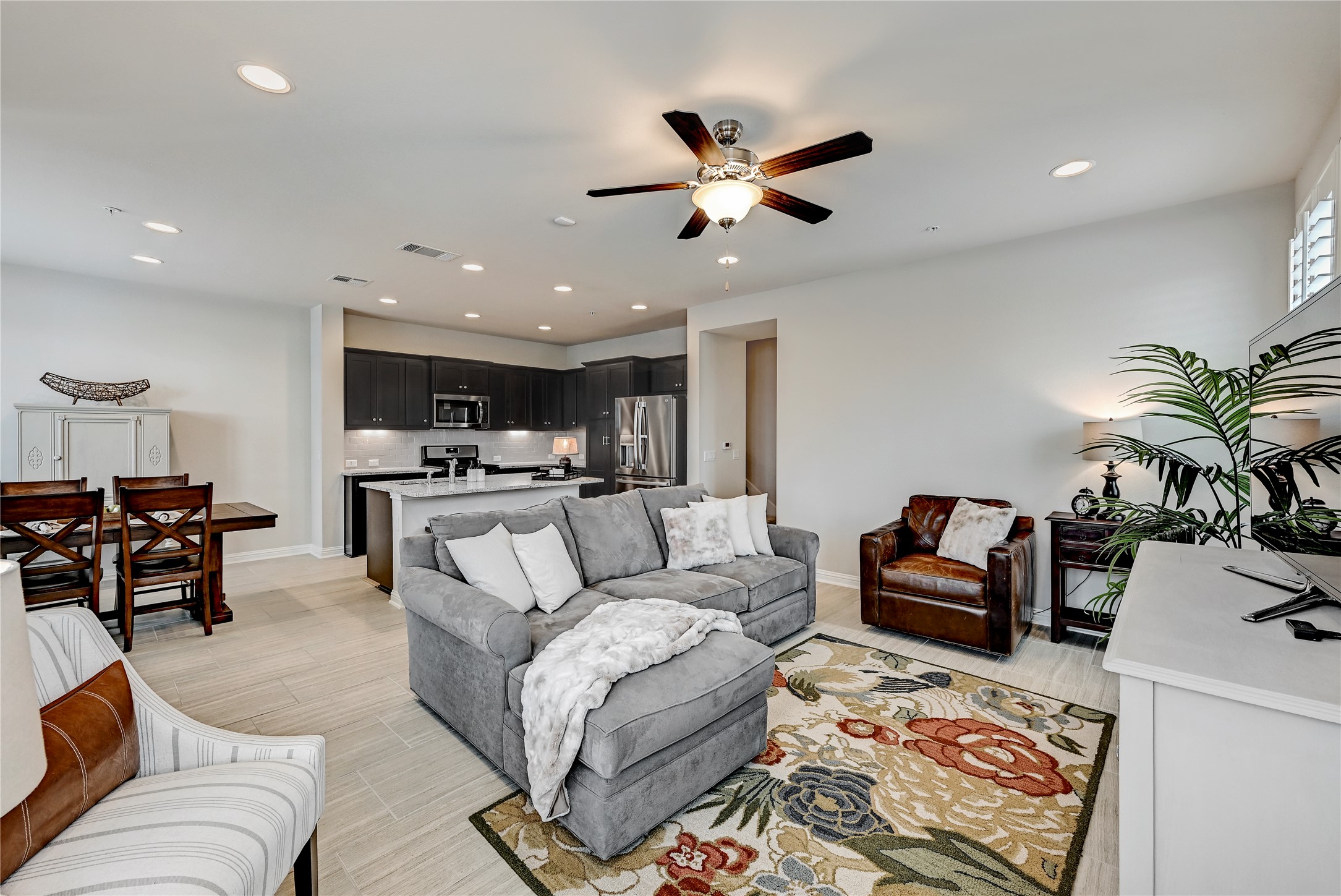 6814 East Riverside Drive, Unit 64 Austin, TX 78741 - Photo 5 of 17 An open concept living area seamlessly blends a contemporary kitchen with a comfortable lounge space.