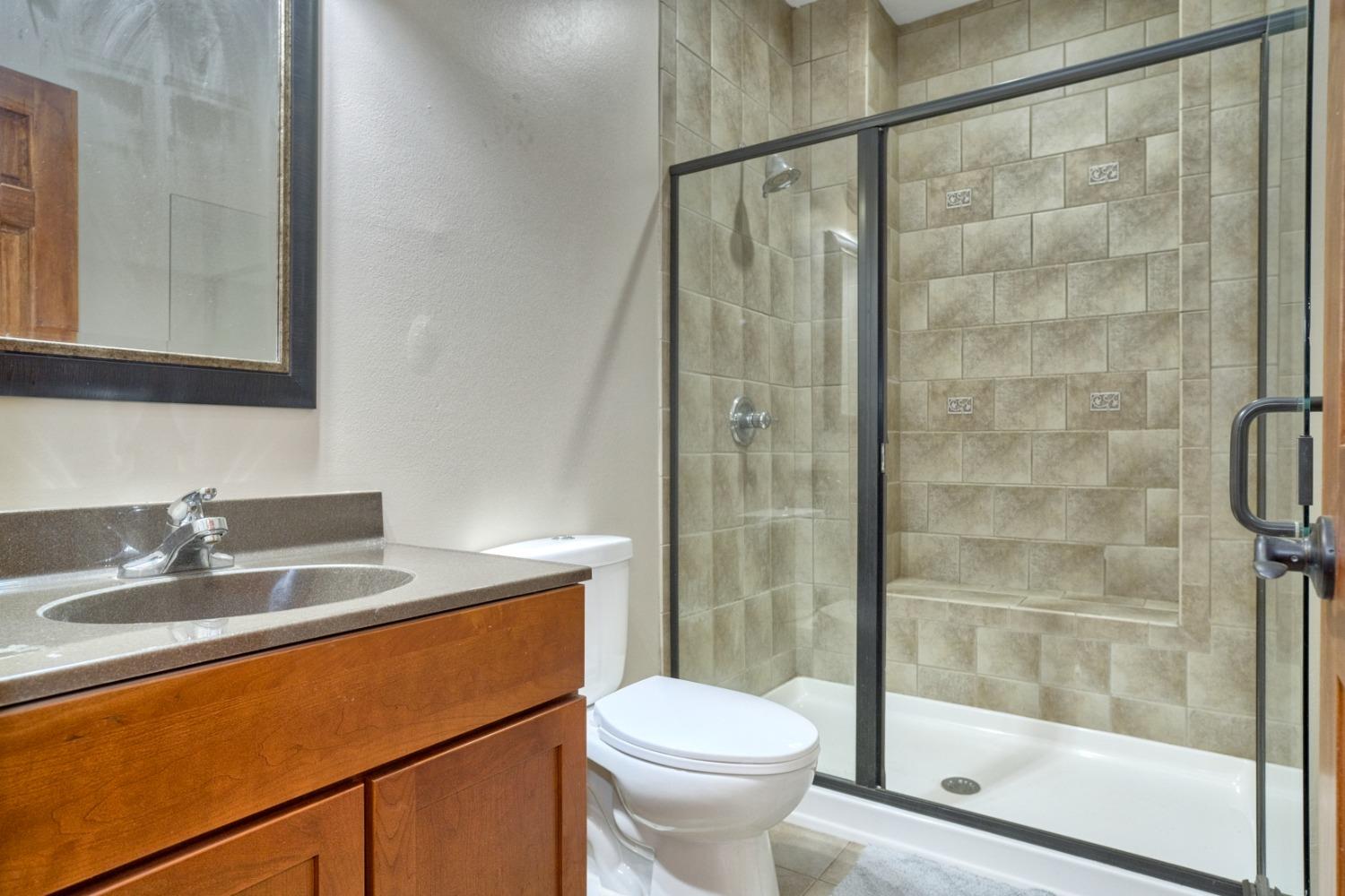 8468 Old Oak Drive Demotte, IN 46310 - Photo 18 of 35 a bathroom with a sink toilet and shower