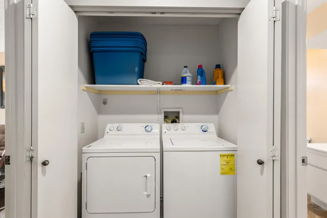 an aerial view of a house with a yard and lake view