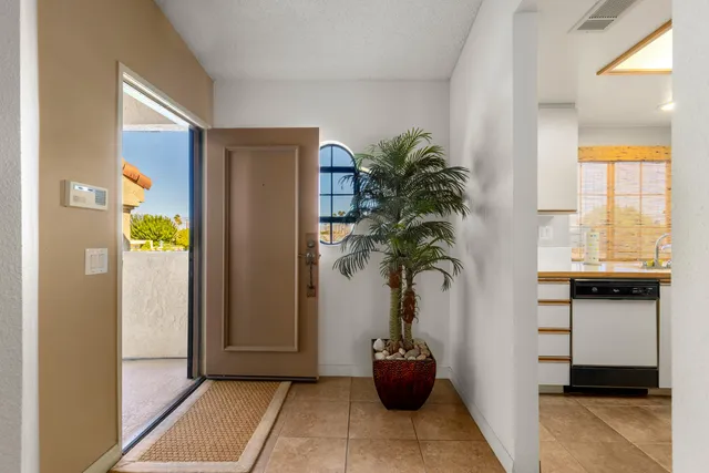 a view of entryway with a potted plant and a window