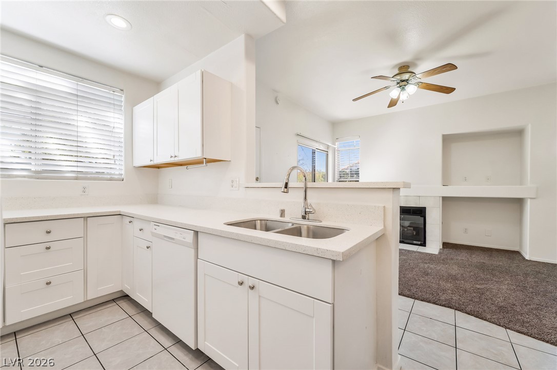 2201 Ramsgate Drive, Unit 811 Henderson, NV 89074 - Photo 6 of 36 A well-appointed kitchen featuring a functional layout seamlessly connecting to a cozy living area.