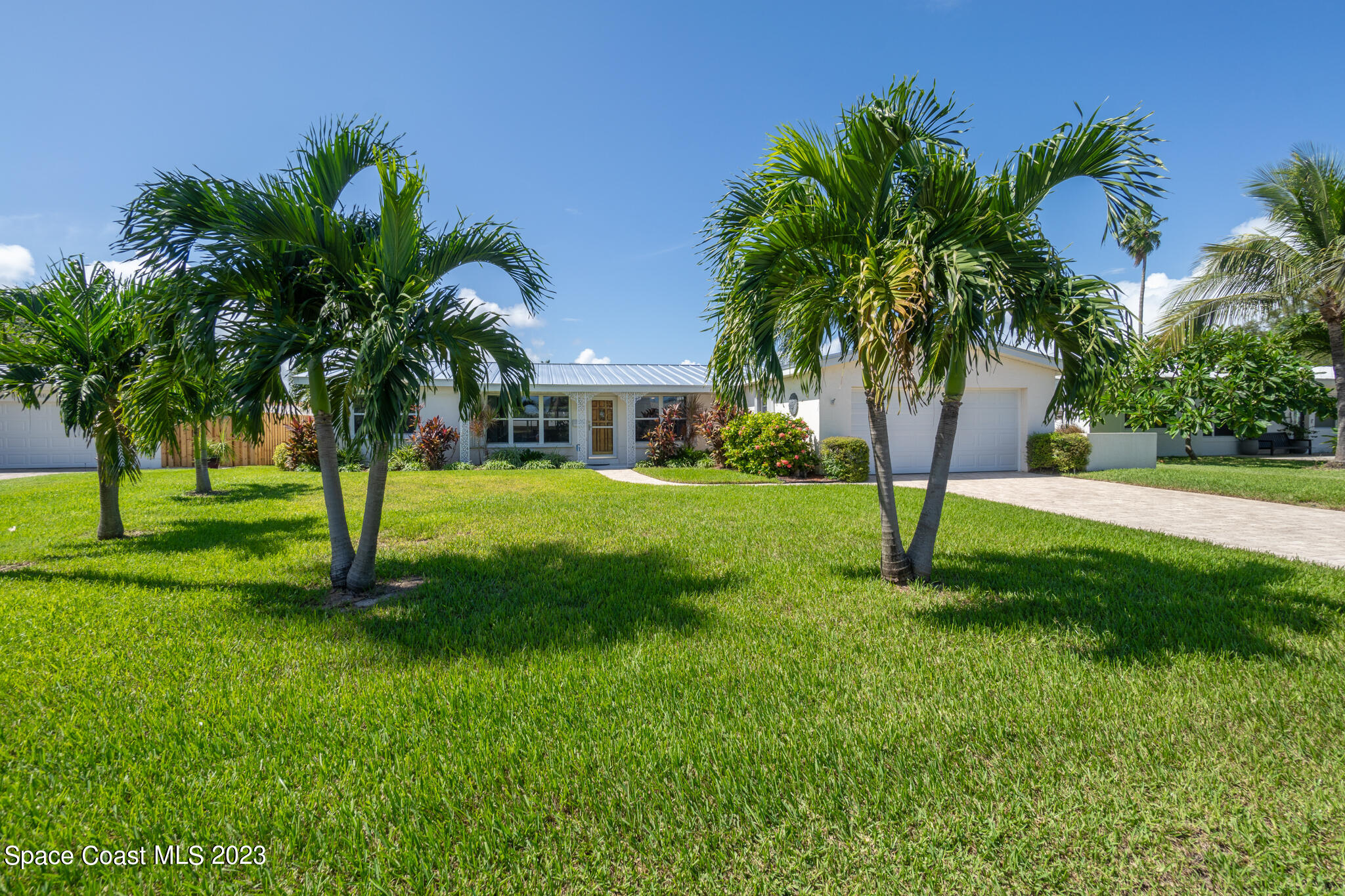 a view of a tree in front of a house