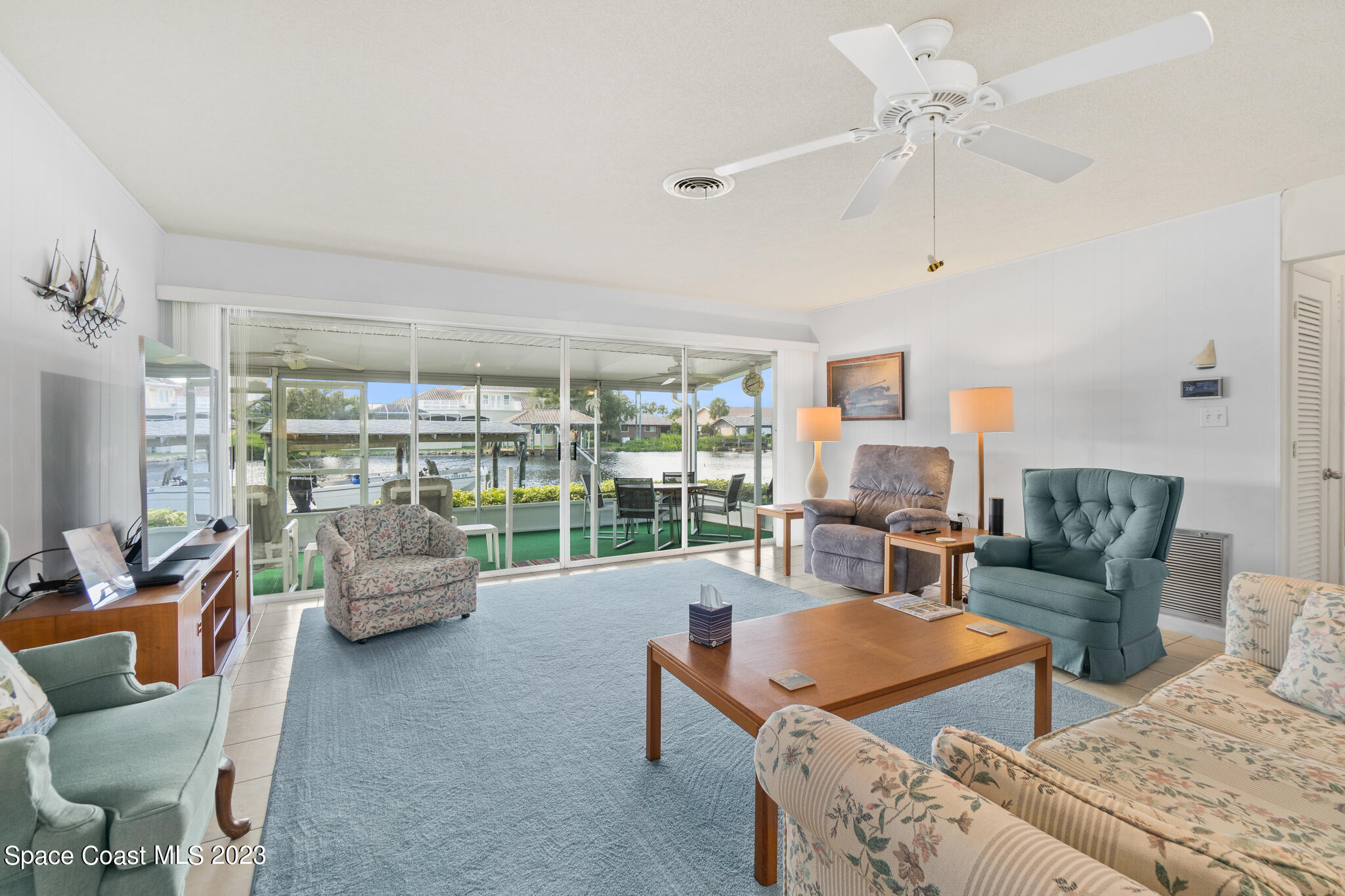 209 River Road Satellite Beach, FL 32937 - Photo 11 of 86 a living room with furniture and a large window