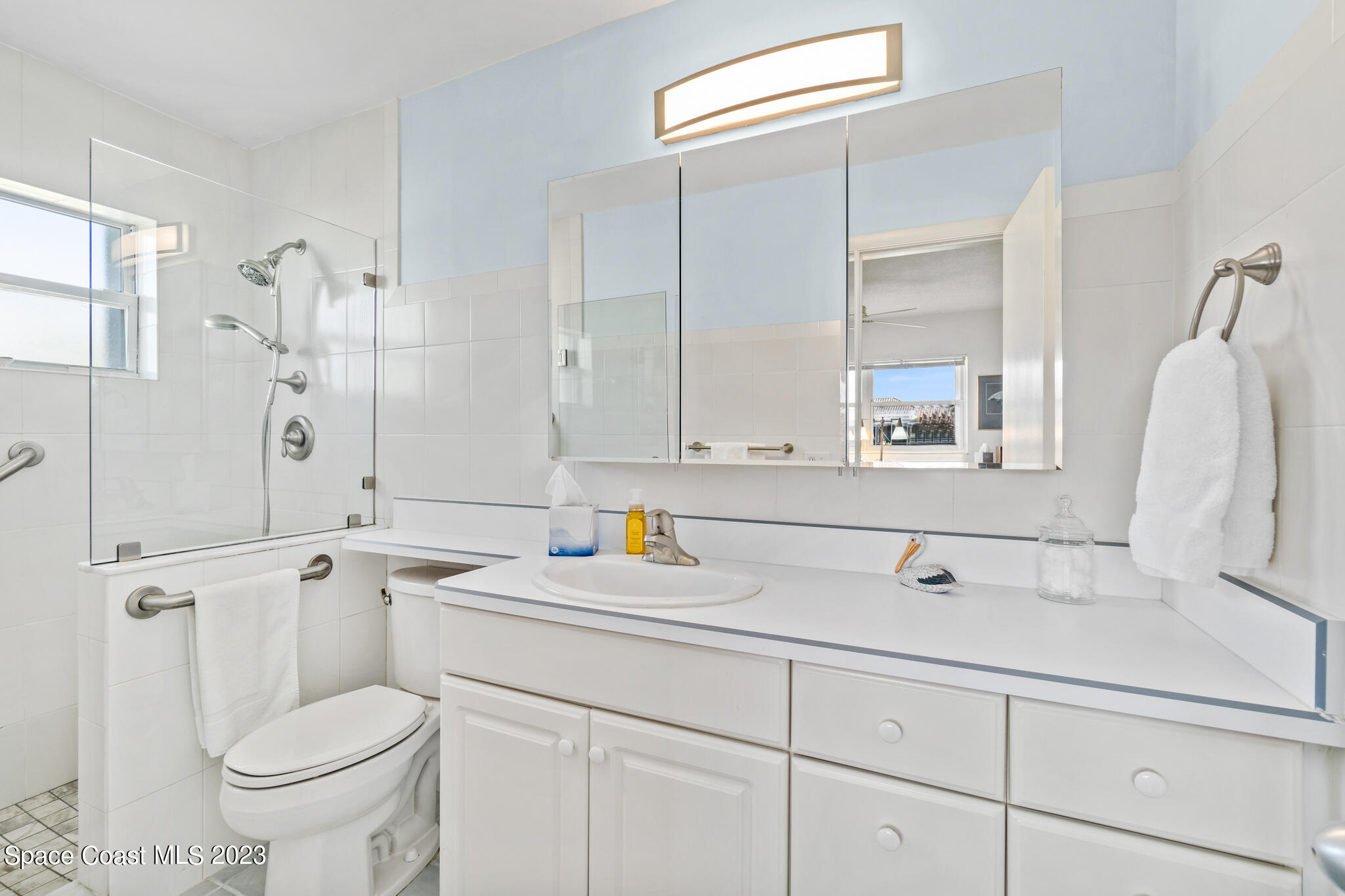 209 River Road Satellite Beach, FL 32937 - Photo 19 of 86 a bathroom with a sink toilet and shower