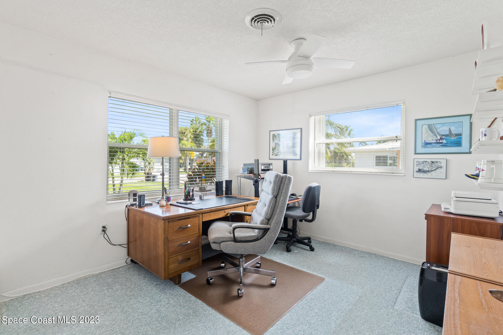 209 River Road Satellite Beach, FL 32937 - Photo 21 of 86 a view of a workspace with furniture and a window