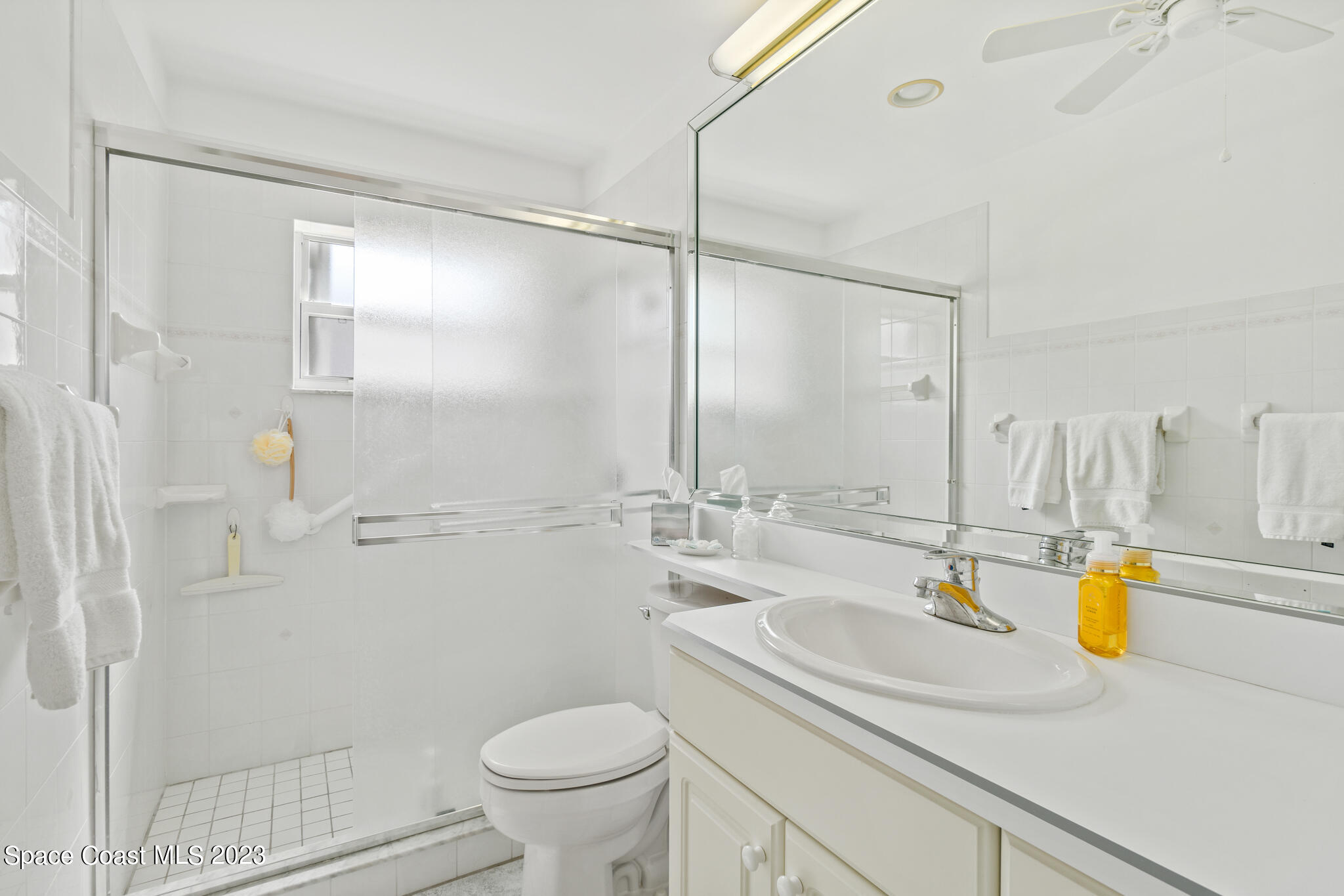 209 River Road Satellite Beach, FL 32937 - Photo 22 of 86 a bathroom with a sink and a mirror