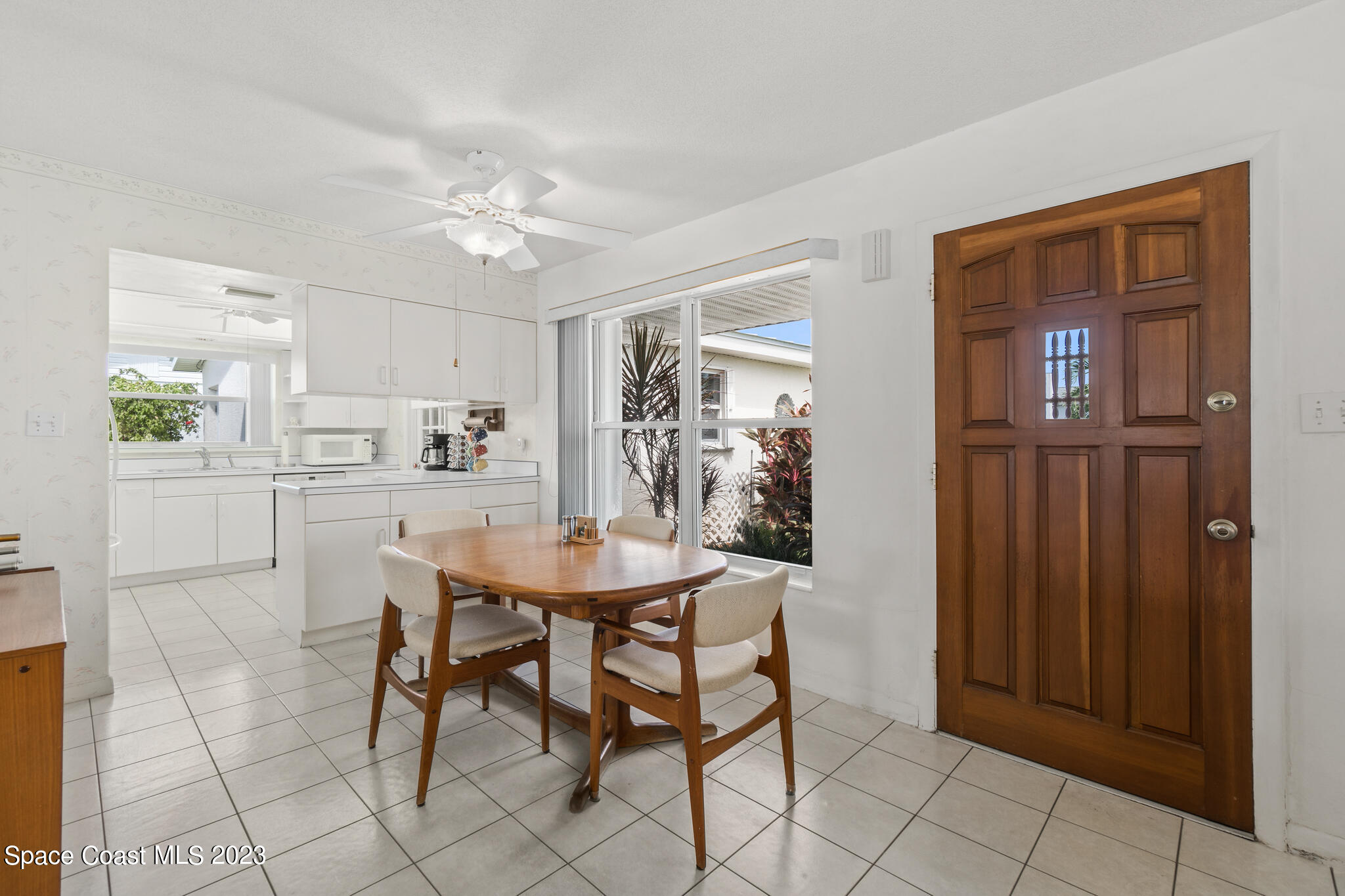 209 River Road Satellite Beach, FL 32937 - Photo 23 of 86 a view of a dining room with furniture and chandelier