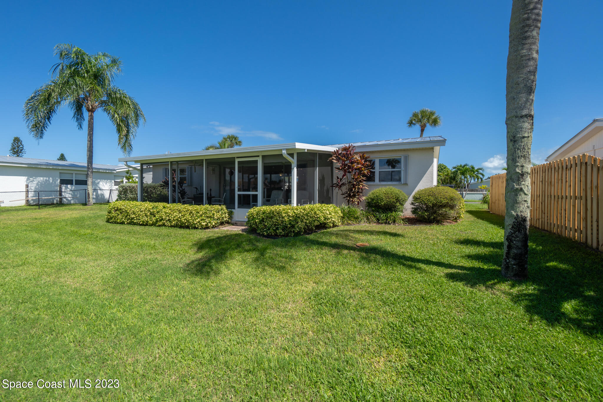209 River Road Satellite Beach, FL 32937 - Photo 39 of 86 a front view of a house with garden