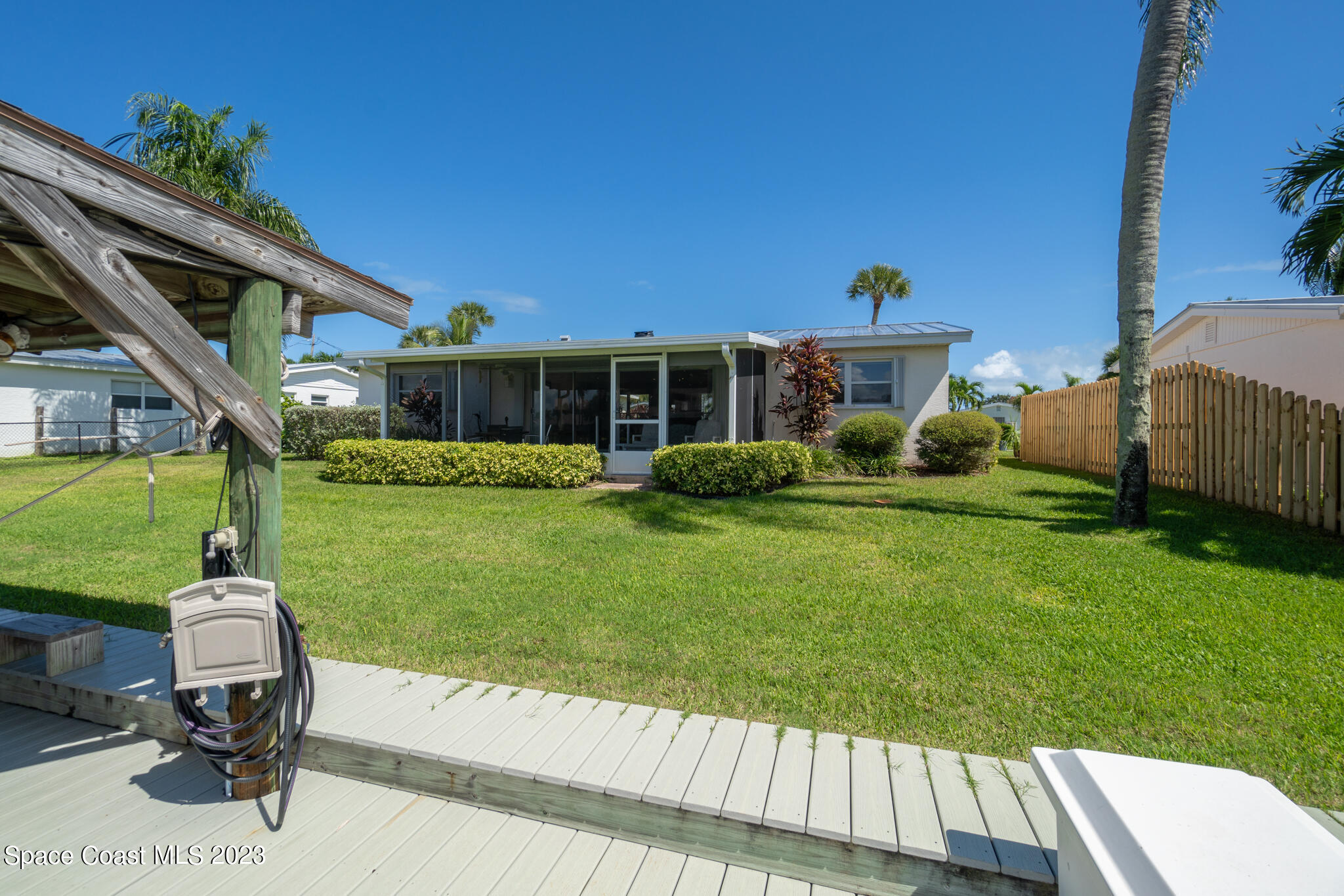 209 River Road Satellite Beach, FL 32937 - Photo 44 of 86 a view of a house with backyard sitting area and garden